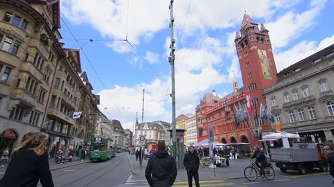 Basel, May 12: Marketplace of Basel with trams, the city hall and people walking around. The city hall in Basel is over 500 years old. Shot at the 12 May 2017. 