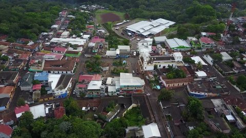 San Salvador - El Salvador June 1, 2017: Drone video of buildings and streets in small Central American town