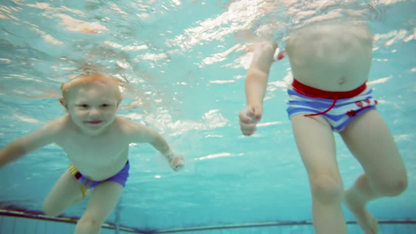 small boy swimming