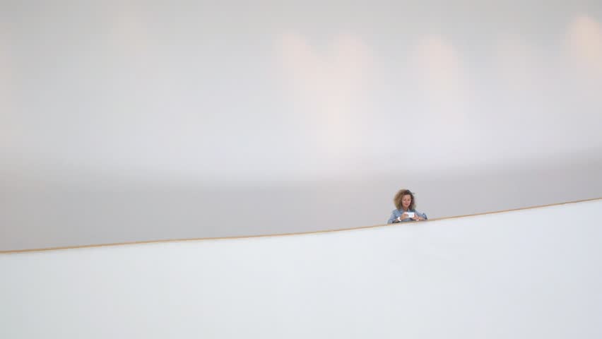 Young Woman Using Smartphone In Art Space. HD, 1920x1080. 