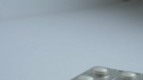 Demonstration of a pills on a white background	
