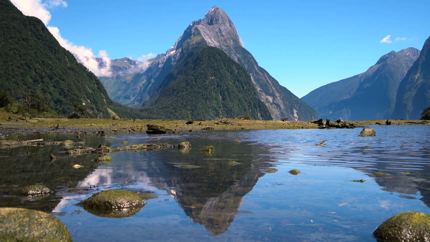 Milford Sound, Fiordland national park, New Zealand - Mitre Peak, Landmark of Milford Sound on water reflection.