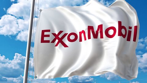 Waving flag with Exxon Mobil logo against moving clouds. 4K editorial animation