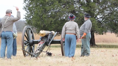 STONES RIVER, TENNESSEE - DECEMBER 31: Civil War soldiers fire cannon at the Battle of Stones River monument in Tennessee on December 31, 2011.
