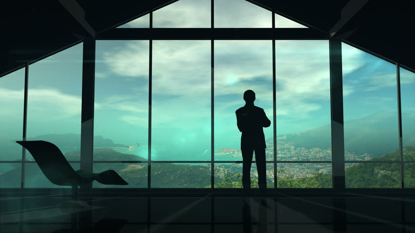 A man is standing by the window viewing IOT infographics elements Royalty-Free Stock Footage #27905881