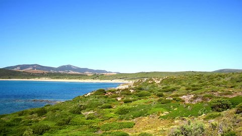 Porto Ferro shoreline on a sunny day in springtime. Sardinia, Italy