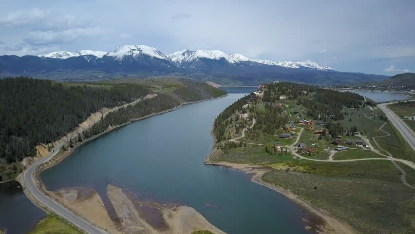 Aerial Dillon Colorado lake luxury homes cliff shore. On I-70 interstate freeway west of Denver. Winter and summer resort and recreation areas with many ski slopes. Tourism destination.