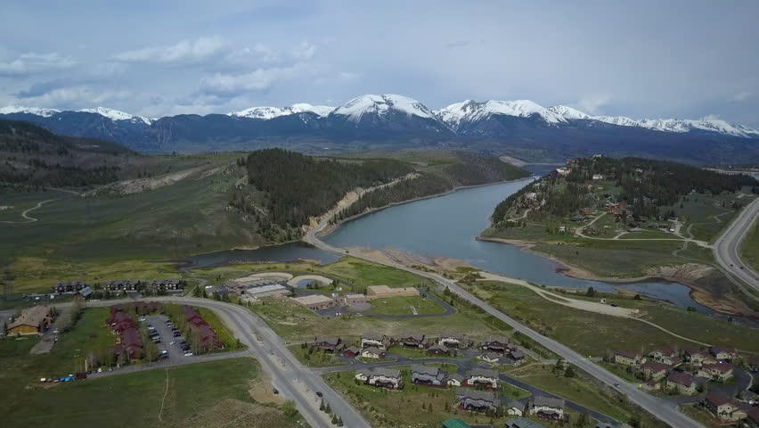Aerial Dillon Colorado lake shore bridge homes. On I-70 interstate freeway west of Denver. Winter and summer resort and recreation areas with many ski slopes. Tourism destination.