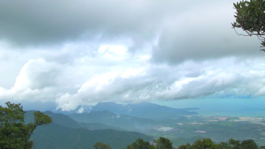 cloudy landscape with hills ans blue sea