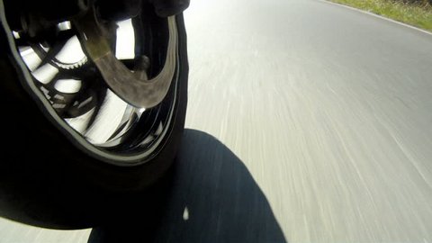 Motorcycle Wheel Close-up racing on the highway