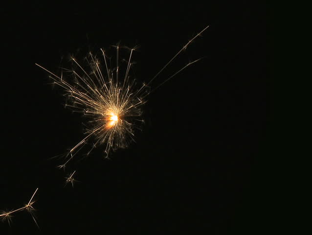 Sparkler. A bright fizzing sparkler on crushed black background. PAL 4:3, 25p