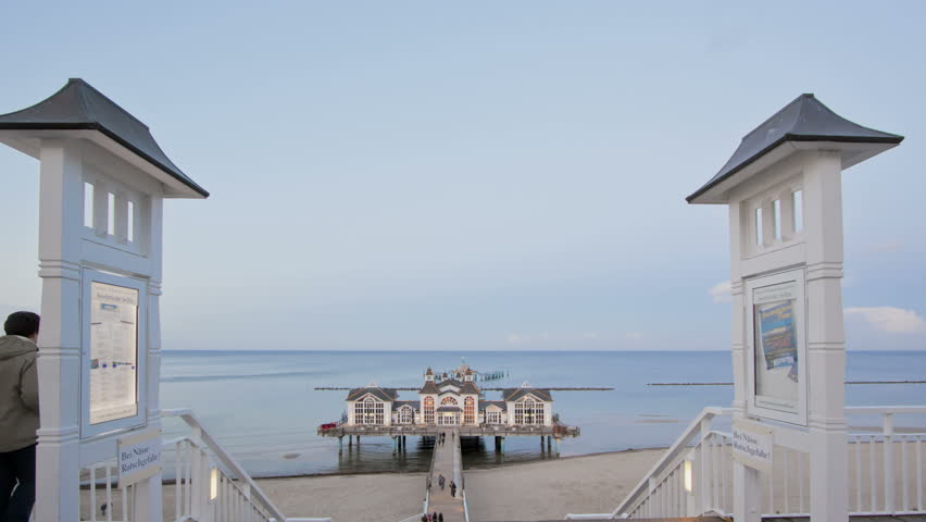 SELLIN, GERMANY, OCT 19, 2011: Timelapse sunset Baltic Sea at Pier Restaurant