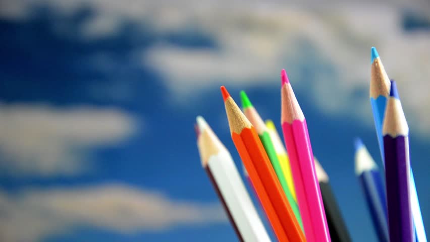 Colored pencils, rotation in the background the sky.