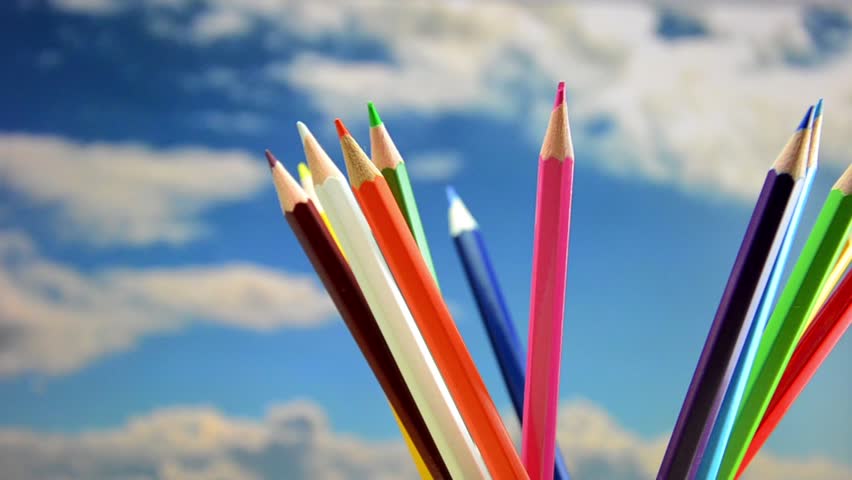 Colored pencils, rotation in the background the sky.