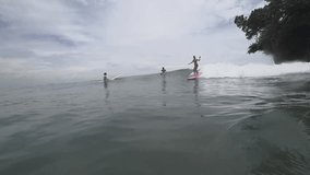Surfer girl on a wave,slow motion 120ps/sec.