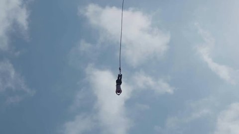 Bungee Jump against Blue Sky (Slow Motion) - Anonymous Woman SiIlhouette