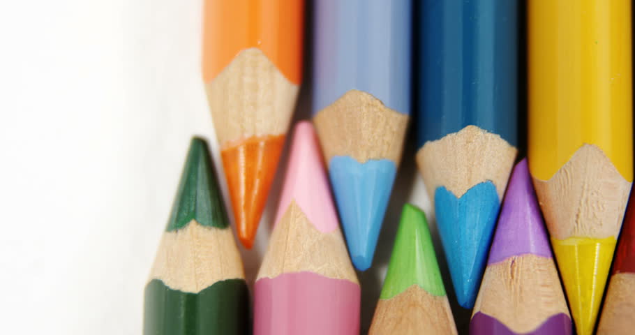 Close-up of colored pencils arranged in interlock pattern