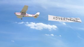 Small propeller airplane towing banner with ADVERTISING caption in the sky. 4K clip