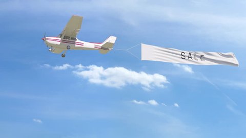 Small propeller airplane towing banner with SALE caption in the sky. 4K clip