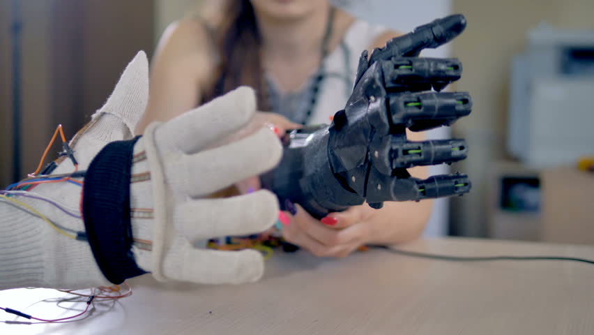 Bionic arm is making some movements. Artificial arm mechanism is being tested. 4K. Royalty-Free Stock Footage #27942553