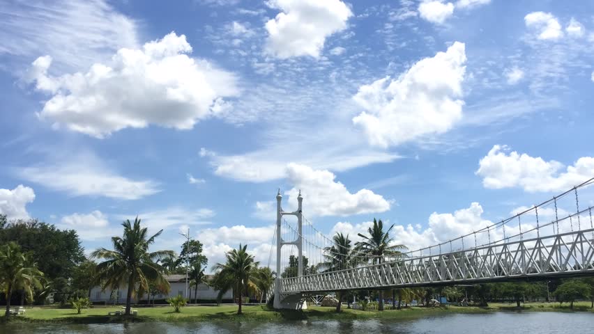 the cloud move in the sky and on the bridge in the public park