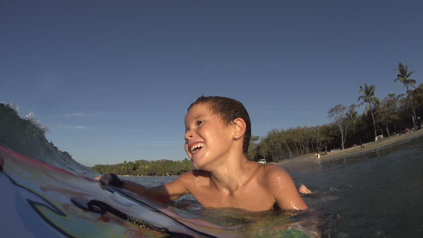 Boy / kid surfing - jumping waves Body Board / boarding at the beach, surfing, surf
