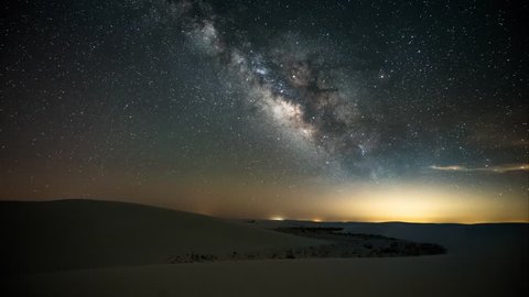 Milky Way timelapse from White Sands National Monument in New Mexico, USA. 4k video taken early morning. The light you see rising from the left toward the end is the moon rising.