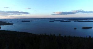 Pielinen, Cinema 4k aerial pan view pielinen lake, filmed from Koli mountain, at a sunset evening, in Lieksa, Karjala, Finland.