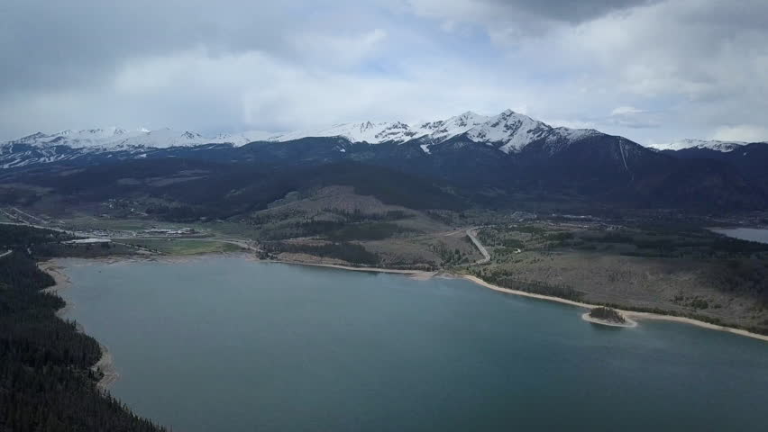 Aerial Dillon Lake Colorado Rocky Mountains pull back. Historic trading post and mining town. On I-70 interstate freeway west of Denver. Winter and summer resort and recreation areas.