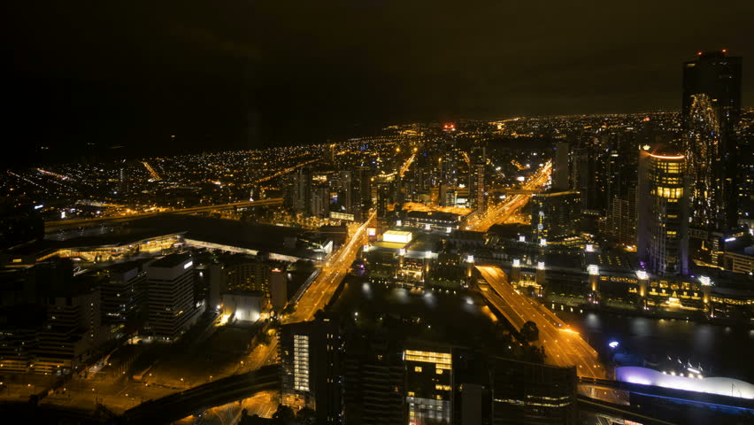 Time lapse Night scene at Melbourne CBD with motion blur traffic light trail. Pan right