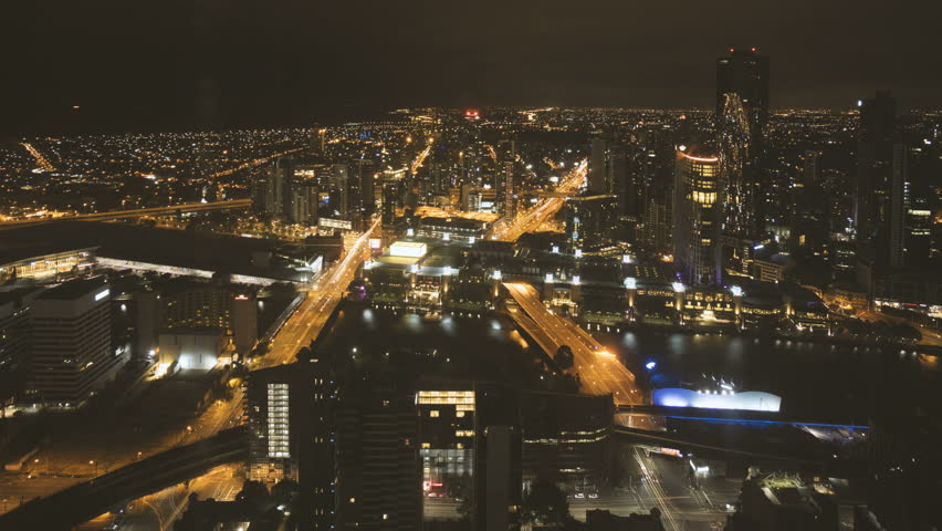 Time lapse Night scene at Melbourne CBD with motion blur traffic light trail. Tilt up