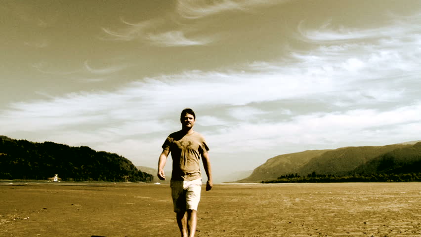 man walking towards camera in the Columbia River Gorge separating Washington and