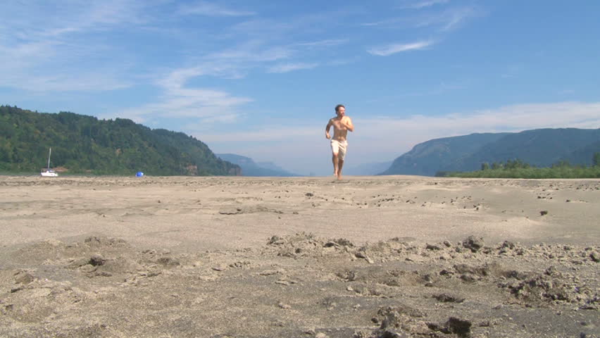 man running in the Columbia River Gorge separating Washington and Oregon.
