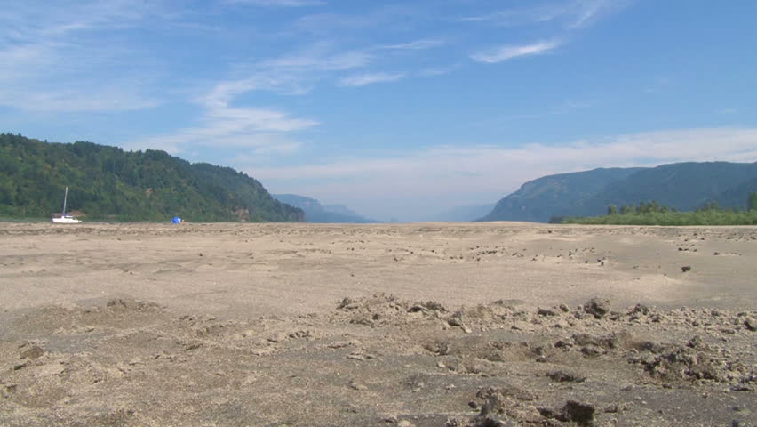 man running away, into the Columbia River Gorge separating Washington and