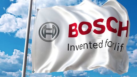 Waving flag with Bosch logo against moving clouds. 4K editorial animation