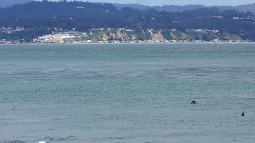Unidentified surfers at Santa Cruz, Pleasure Point, on the northern Monterey Bay in Santa Cruz County, California, USA, a world renowned surf location