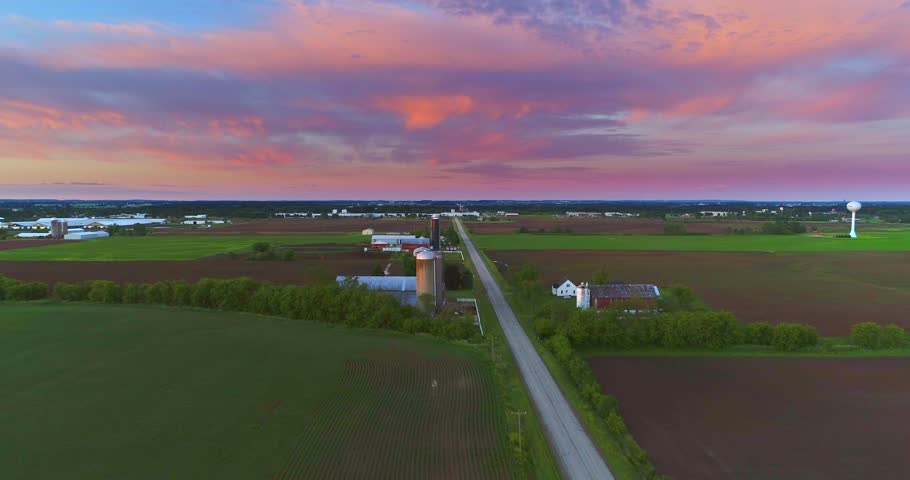 Dramatic sky over rural Wisconsin agricultural landscape.
