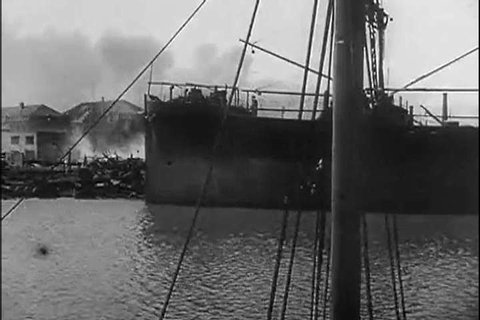 1940s: Ships burn in Dunkirk's docks after a battle in 1940.
