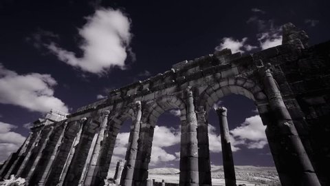 Ancient Roman ruins at the archaelogical UNESCO Heritage site of Volubilis in Morocco. Time lapse shot in