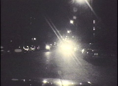 HOLLYWOOD CALIFORNIA - OCTOBER 2:  Vintage super 8 time lapse night driving shot of Sunset Bl and the Hollywood 101 Freeway on October 2, 1986 in Hollywood, California. 