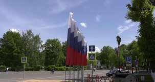 Video footage view of central square of Yaroslavl city on public holiday with tourists and flags waving in Yaroslavl Oblast area, 260 km north-east of Moscow, central Russia