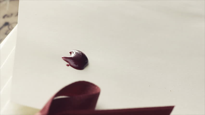 Wax dropping on a blank paper