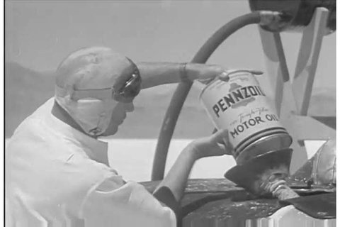 1930s: Salesmen meet in an office and discuss selling Pennzoil motor oil, referencing auto racer Ab Jenkins, in 1935.
