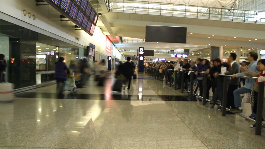 HONG KONG - DECEMBER 21: Time lapse of People in the arrivals hall at Hong Kong