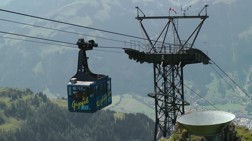 Large Mountain Cable car stock footage. A large Mountain cable car arrives