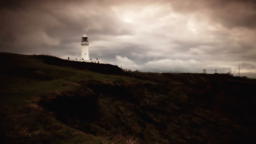 Lighthouse in the daytime with a dramatic skyline HD stock footage
