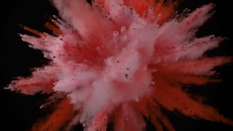 Colorful powder/particles fly after being exploded against black background. Shot with high speed camera, phantom flex 4K. Slow Motion. Included 2 different color versions.