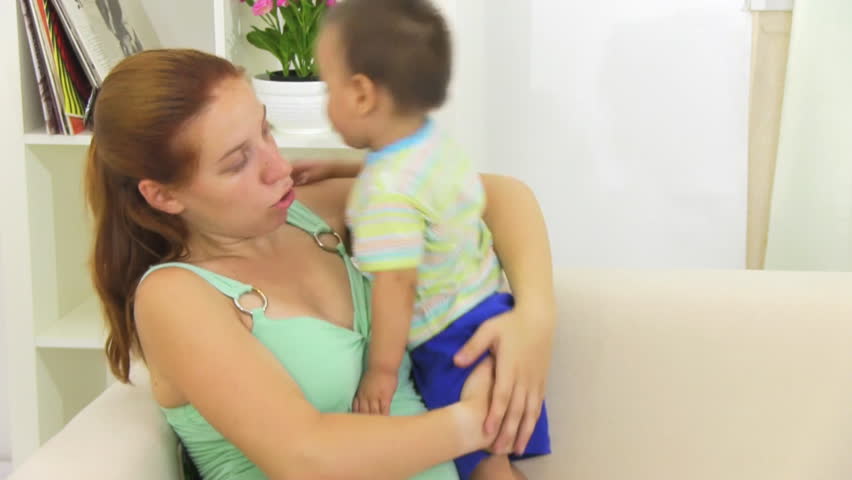 pregnant woman playing with her son
