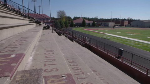 Empty student section of a high school football stadium Arkivvideo