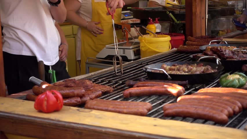 WROCLAW, POLAND - JUNE 04, 2017: Cook grilled Meat roasting on a Street Food Festival